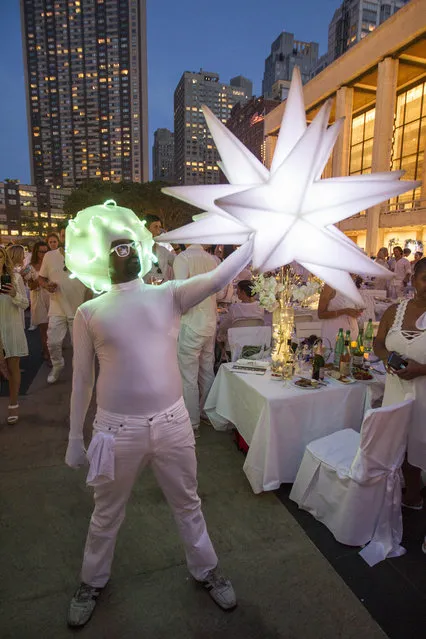 Sidney Oolongo at the annual Dinner en Blanc, this year hosted in Lincoln Center in New York, USA on August 22, 2017. (Photo by Erik Thomas/The New York Post)