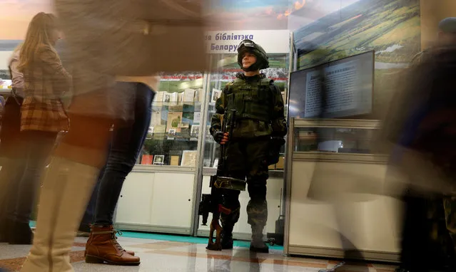 A Belarusian soldier with a machine gun stands at an exposition during the XXVII Minsk International Book Fair in Minsk, Belarus on February 5, 2020. (Photo by Vasily Fedosenko/Reuters)