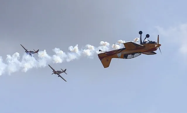 Yakovlev Yak-54 (R) and SP-129 trainer aircrafts of Russia's Pervy Polet (First Flight) aerobatic team perform during the MAKS International Aviation and Space Salon in Zhukovsky, outside Moscow, Russia, August 29, 2015. (Photo by Maxim Shemetov/Reuters)