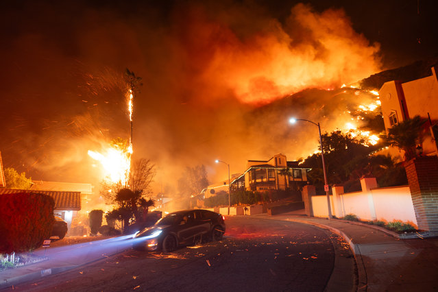 Fire threatens homes in Los Angeles, California on January 7, 2025. (Photo by VCG/Getty Images)