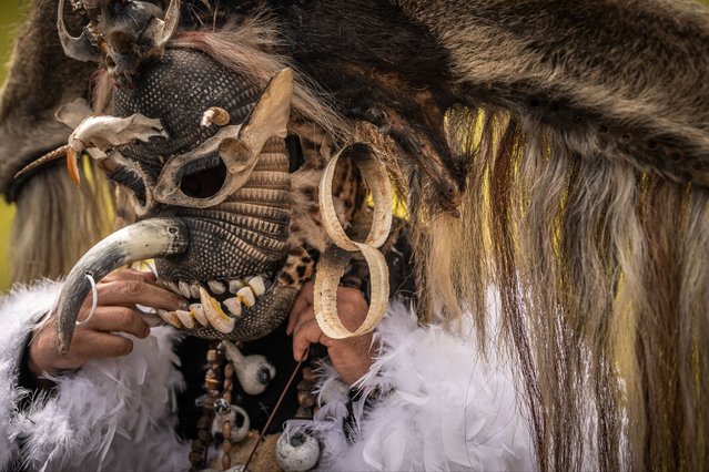 A “Cachacero” (Cuadrillero) parades in his horse during the “Cuadrillas de San Martin” as part of the 56th Folkloric and Tourist International Festival of the “llano” on November 12, 2023 in San Martin, Colombia. The “Cuadrillas de San Martin” is a tradition almost 300 years old in which horsemen in San Martin show their skills in a contest with a series of 10 different games. It is not clear if the tradition comes from Spanish riders or from the Achagua indigenous, but the reason of the games was for fighting the territory between the Galanes, Moros, Guahibos and Cachaceros cultures, representing (in the same order) the Spanish, Arabs, indigenous and Africans. Today, it is one of Colombia's most recognized cultural expressions in the country and abroad. (Photo by Diego Cuevas/Getty Images)