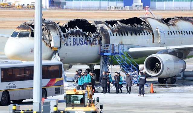 An Air Busan airplane is severely damaged from a fire at Gimhae International Airport in Busan, South Korea, 29 January 2025. On 28 January the plane bound for Hong Kong caught fire from inside while preparing to take off, prompting 176 people to evacuate. (Photo by Yonhap/EPA)