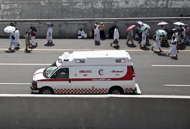 An ambulance drives towards the camp city at Mina, near the holy city of Mecca September 24, 2015. (Photo by Ahmad Masood/Reuters)
