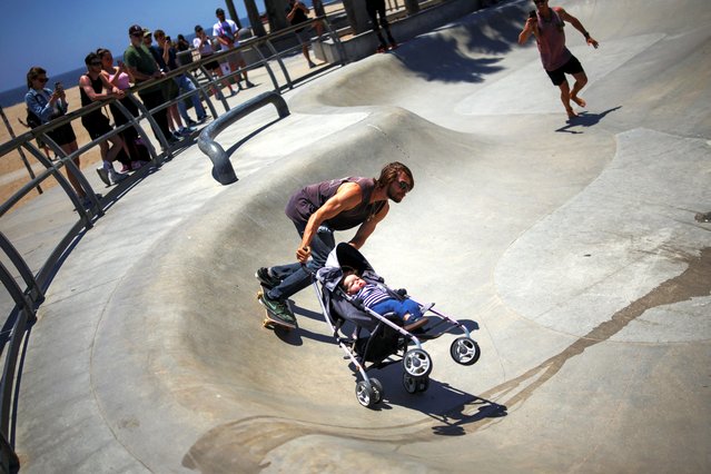 A skateboarder rides at Venice Skatepark with a baby doll in a stroller for a social media video in Los Angeles, California, U.S., May 19, 2025. (Photo by Daniel Cole/Reuters)