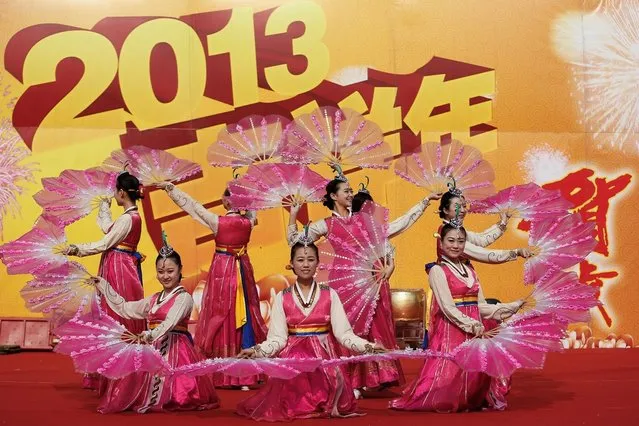Chinese folk artists perform during the opening ceremony of the Spring Festival Temple Fair at Dragon Lake Park on February 9, 2013 in Beijing, China.The Chinese Lunar New Year of Snake also known as the Spring Festival, which is based on the Lunisolar Chinese calendar, is celebrated from the first day of the first month of the lunar year and ends with Lantern Festival on the Fifteenth day.  (Photo by Lintao Zhang)