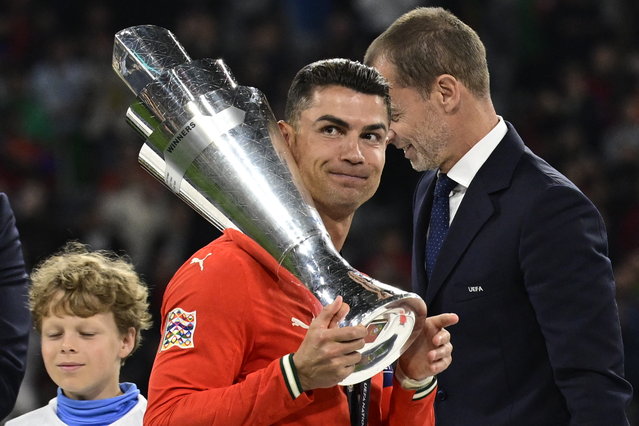 Portugal's forward #07 Cristiano Ronaldo carries the trophy after winning the UEFA Nations League final football match between Portugal and Spain in Munich, southern Germany on June 8, 2025. (Photo by John A. McDougall/AFP Photo)