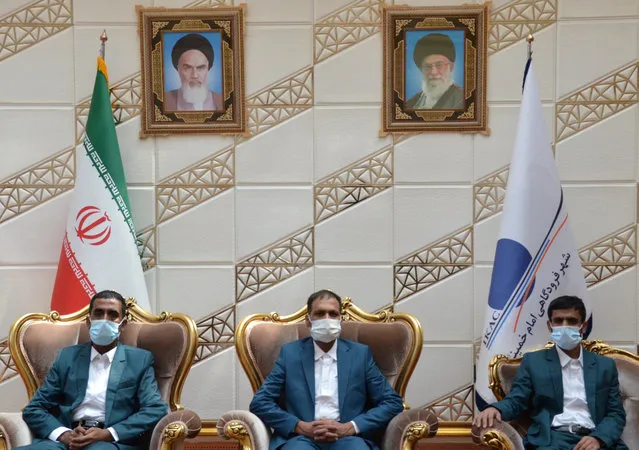 Three Iranian fishermen, who, according to maritime security officials, were released by Somali pirates after being held for five years, pose for a photo in the VIP hall of Imam Khomeini Airport, in Tehran, Iran on August 21, 2020. (Photo by WANA (West Asia News Agency) via Reuters)