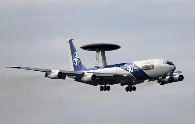 A NATO “Boeing E-3A AWACS” airplane lands at a military airbase next to Henri Coanda international airport in Bucharest, Romania, on January 17, 2022. NATO send surveillance aircraft to Romania to bolster its eastern flank and “monitor Russian military activity”, the alliance said on Januaray 13, 2023. The Western military alliance has strengthened its presence in the region since Russia invaded Ukraine, which borders Romania, a NATO member. AWACS (Airborne Warning and Control System planes) can detect aircraft hundreds of kilometres away, making them a key capability for NATO's deterrence and defence posture. The planes arrive on January 17 in Otopeni, near Bucharest, and are part of a fleet of 14 NATO Boeing E-3A AWACS aircraft, usually based in Geilenkirchen, western Germany. (Photo by Daniel Mihailescu/AFP Photo)