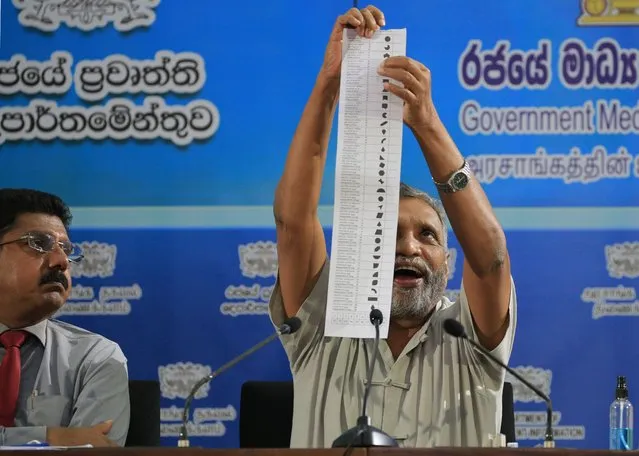 Chairman of Election Commission of Sri Lanka, Mahinda Deshapriya, explains how to cast vote using a sample ballet paper (made for demonstration only) watched by Director General of Health Services, Anil Jasinghe (L) during a press conference at Colombo, Sri Lanka, on 03 August 2020. Sri Lanka will hold Parliamentary Election on August 5 and the Chairman of Election Commission of Sri Lanka, Mahinda Deshapriya assured that measures have been taken to ensure safety of the voters amid the Covid-19 outbreak. (Photo by Tharaka Basnayaka/NurPhoto via Getty Images)