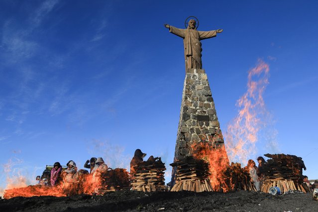 People take part in a ritual during the celebration of the Month of Pachamama, or Mother Earth, in La Cumbre, Bolivia, 01 August 2025. (Photo by Gabriel Marquez/EPA)