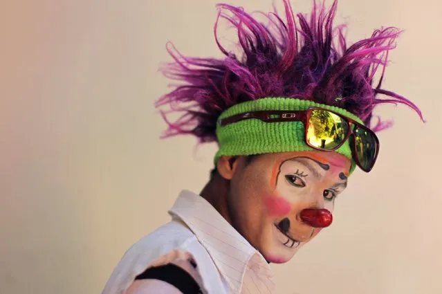 A Salvadorean clown going by the name of “Cordelito” poses during National Clown Day celebrations at Beethoven Square in San Salvador December 3, 2014. (Photo by Jose Cabezas/Reuters)