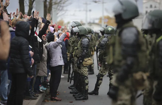 People argue with policemen during an opposition rally to protest the official presidential election results in Minsk, Belarus, Sunday, November 1, 2020. (Photo by AP Photo/Stringer)