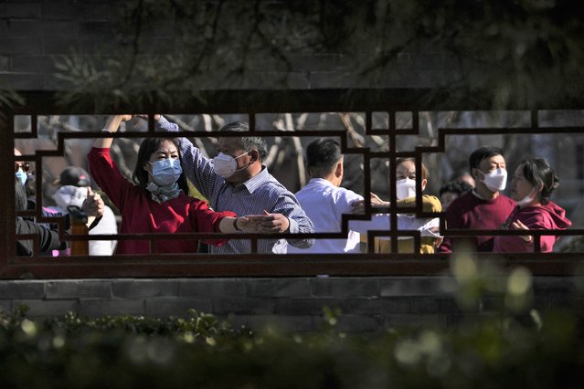 Residents, some wearing face masks, practice a social dance with their companion at a public park in Beijing Thursday, March 2, 2023. (Photo by Andy Wong/AP Photo)