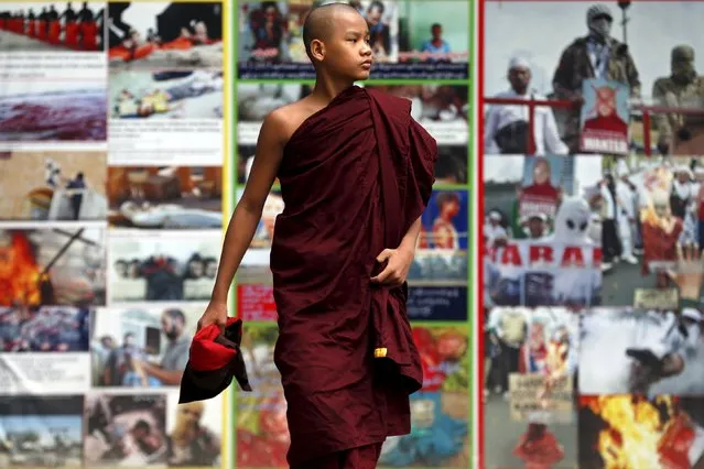 A Buddhist monk walks past anti-Muslim billboards inside the Masoyein monastery complex in Mandalay October 7, 2015. (Photo by Jorge Silva/Reuters)