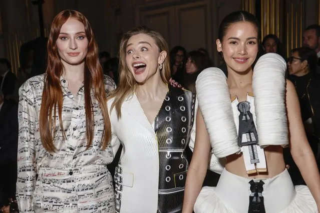 English actress Sophie Turner, from left, American actress Chloe Grace Moretz and Thai-Norwegian actress and model Urassaya Sperbund attend the Louis Vuitton Fall/Winter 2023-2024 ready-to-wear collection presented Monday, March 6, 2023 in Paris. (Photo by Vianney Le Caer/Invision/AP Photo)