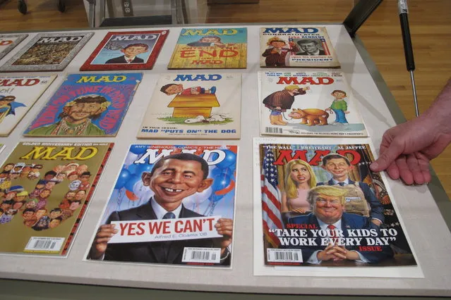 A new exhibit celebrating the artistic legacy of MAD magazine that includes several examples of magazines over the years is displayed on Thursday, May 3, 2018, in Columbus, Ohio. “Artistically Mad: Seven Decades of Satire” opens at the Billy Ireland Cartoon Library & Museum at Ohio State University on Saturday, May 5, and runs through Oct. 21. The exhibit will include original drawings and paintings, displays of vintage MAD magazines and memorabilia such as trading cards and board games. (Photo by Andrew Welsh-Huggins/AP Photo)