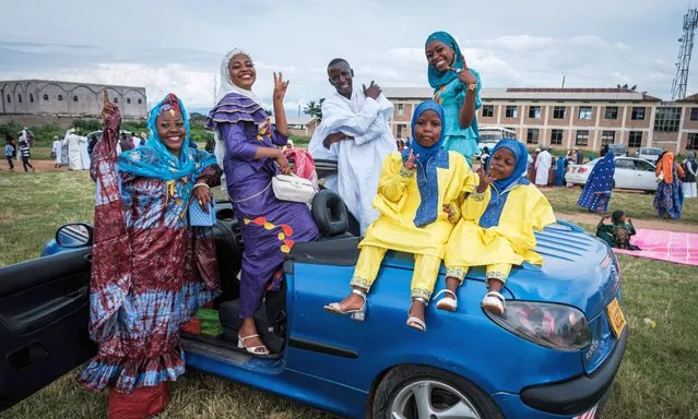 Muslim worshippers pose after the prayer on the first day of Eid al-Fitr, which marks the end of the holy fasting month of Ramadan, in Bujumbura, Burundi on April 21, 2023. (Photo by Tchandrou Nitanga/AFP Photo)