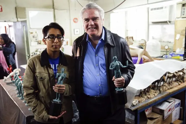 Screen Actors Guild (SAG) Award nominated actors Tony Revolori (L) and Michael Harney hold the patina coated and mounted statutes of “The Actor” during a media event on the production of the statuettes for the 21th annual SAG Awards at American Fine Arts Foundry in Burbank, California January 13, 2015. (Photo by Patrick T. Fallon/Reuters)