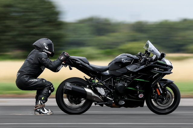 British motorcycle stunt champion Jonny Davies practices for his World Record attempt for the 'Fastest speed being dragged behind a motorcycle at Elvington Airfield, in Elvington, North Yorkshire, Britain, 05 August 2024. Davies will attempt on 18 August to break the current record of 251.54 km per hour which was set by Gary Rothwell of Liverpool in 1999. (Photo by Adam Vaughan/EPA)