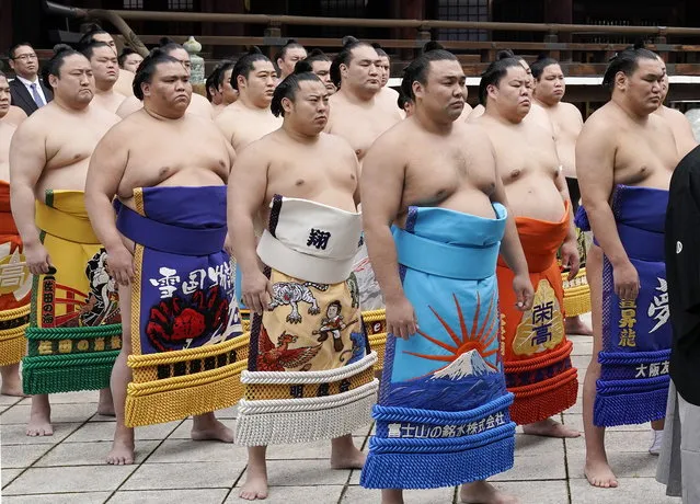 Sumo wrestlers attend a shinto ritual during the annual dedicated grand sumo tournament “Honozumo” at Yasukuni Shrine in Tokyo, Japan, 17 April 2023. The tournament was held at the shrine for the first time in four years due to the COVID-19 pandemic. (Photo by Kimimasa Mayama/EPA)