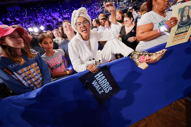 A supporter shows their boot during a campaign rally held by Kamala Harris, at East Carolina University, in Greenville, North Carolina, on October 13, 2024. (Photo by Jonathan Drake/Reuters)