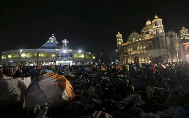 Pilgrims sleep an improvised camp site at the Basilica of Guadalupe during the annual pilgrimage in honor of the Virgin of Guadalupe, patron saint of Mexican Catholics, in Mexico City, Mexico December 11, 2015. (Photo by Henry Romero/Reuters)