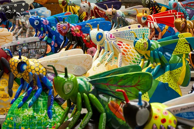 Bee in the city, a display of more than 100 giant bee sculptures, is being installed in locations across Manchester, England on July 18, 2018, to create an arts trail. Each bee has been individually designed and decorated to reflect the city, its industrial heritage and music scene. (Photo by Christopher Thomond/The Guardian)