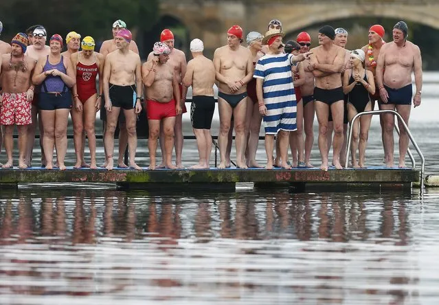 Swimmers prepare to take part in the annual Christmas Day Peter Pan Cup handicap race in the Serpentine River, in Hyde Park, London, December 25, 2015. (Photo by Andrew Winning/Reuters)