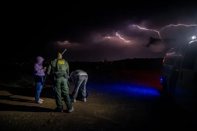 A Border Patrol officer process migrants from Colombia after they crossed the Rio Grande on May 22, 2022 in Eagle Pass, Texas. Title 42, the controversial pandemic-era border policy enacted by former President Trump, which cites COVID-19 as the reason to rapidly expel asylum seekers at the U.S. border, was set to officially expire on May 23rd. A federal judge in Louisiana delivered a ruling blocking the Biden administration from lifting Title 42. (Photo by Brandon Bell/Getty Images)