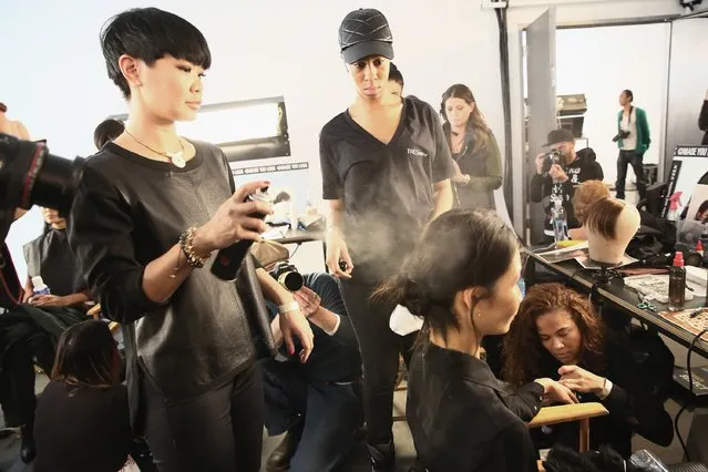 A model prepares backstage at the Marissa Webb fashion show with TRESemme during Mercedes-Benz Fashion Week Fall 2015 on February 12, 2015 in New York City. (Photo by Astrid Stawiarz/Getty Images for TRESemme)