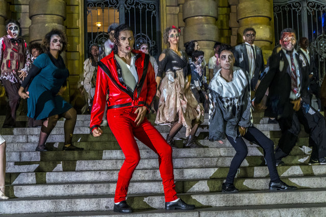 Fans of singer Michael Jackson flashmob on the steps of the Municipal Theater in São Paulo dancing Thriller on the day that the singer would turn 60 if he were alive, August 29, 2018. (Photo by Cris Faga/NurPhoto via Getty Images)