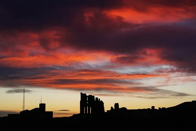 The sun rises over Tynemouth Priory on the North East coast on Monday, January 9, 2023. (Photo by Owen Humphreys/PA Images via Getty Images)
