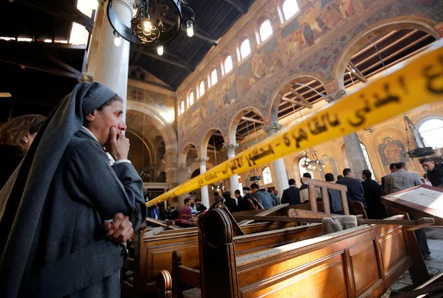 A nun cries as she stands at the scene inside Cairo's Coptic cathedral, following a bombing, in Egypt December 11, 2016. (Photo by Amr Abdallah Dalsh/Reuters)