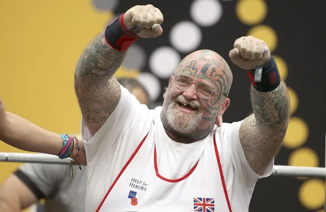 In this October 24, 2018, photo, Britain's Paul Guest celebrates after a successful lift during the powerlifting competition at the Invictus Games in Sydney. (Photo by Rick Rycroft/AP Photo)