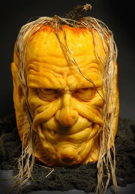 A horror face carved out of a pumpkin by Ray Villafane and team in Bellaire, Michigan. (Photo by Ray Villafane/Barcroft Media)