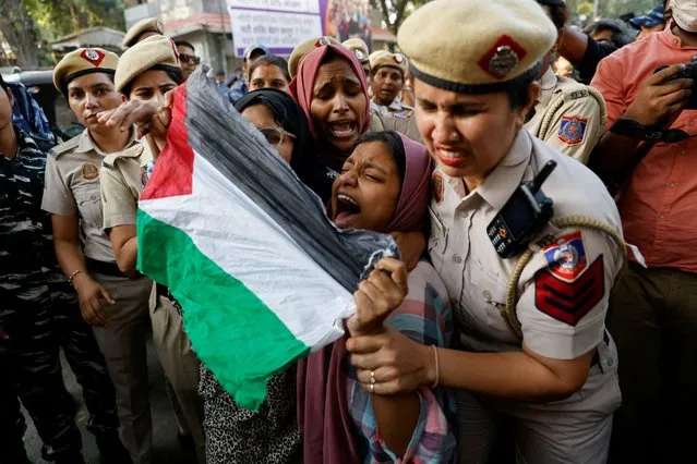 Police detain pro-Palestinian demonstrators at a protest organised by a student organisation and a socio-religious organisation in support of Palestinians in Gaza, as the conflict between Israel and Hamas continues, near Jantar Mantar in New Delhi, India on October 27, 2023. (Photo by Anushree Fadnavis/Reuters)