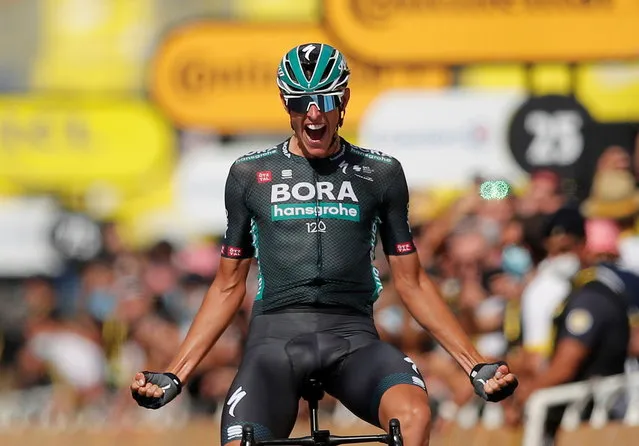 German Nils Politt celebrates as he crosses the finish line to win stage 12 of the Tour de France cycling race over 159.4 kilometers (99 miles) from Saint-Paul-Trois-Chateaux to Nimes, France on July 8, 2021. (Photo by Stephane Mahe/Reuters)