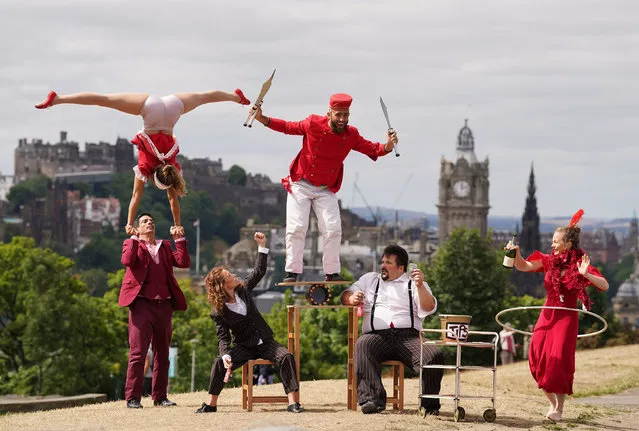 Circus company “Lost in Translation” show off some tricks at the top of Calton Hill, in Edinburgh on Monday, August 1, 2022, as they prepare to show their family show, Hotel Paradiso at the Circus Hub throughout the Edinburgh Festival Fringe. (Photo by Andrew Milligan/PA Wire)