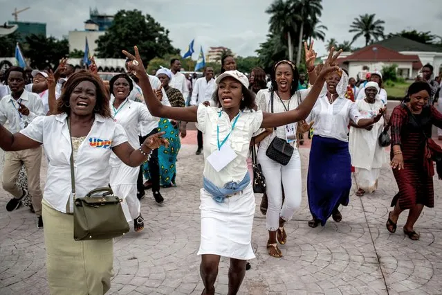 Supporters of Democratic Republic of Congo's new President celebrate ahead of the Presidential inauguration on January 24, 2018. Felix Tshisekedi prepares to be sworn in as president of Democratic Republic of Congo, marking the country's first-ever peaceful handover of power after chaotic and bitterly-disputed elections. (Photo by John Wessels/AFP Photo)