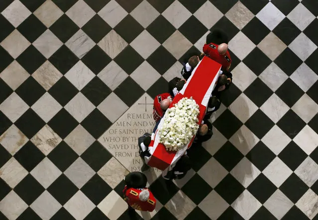 The coffin containing the body of former British Prime Minister Margaret Thatcher arrives for the ceremonial funeral at St Paul's Cathedral in London, Wednesday April 17, 2013. (Photo by Stefan Wermuth/AP Photo)
