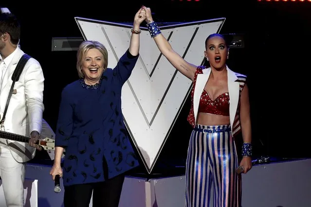 Singer Katy Perry raises arms with U.S. Democratic presidential candidate Hillary Clinton at the end of the Hillary Victory Fund “I'm With Her” benefit concert at Radio City Music Hall in the Manhattan borough of New York City, March 2, 2016. (Photo by Mike Segar/Reuters)