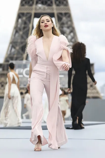 Amber Heard wears a creation for the L'Oreal Spring-Summer 2022 ready-to-wear fashion show presented in Paris, Sunday, October 3, 2021. (Photo by Vianney Le Caer/Invision/AP Photo)