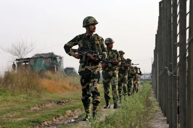 India's Border Security Force (BSF) soldiers patrol along the fenced border with Pakistan in Ranbir Singh Pura sector near Jammu February 26, 2019. (Photo by Mukesh Gupta/Reuters)