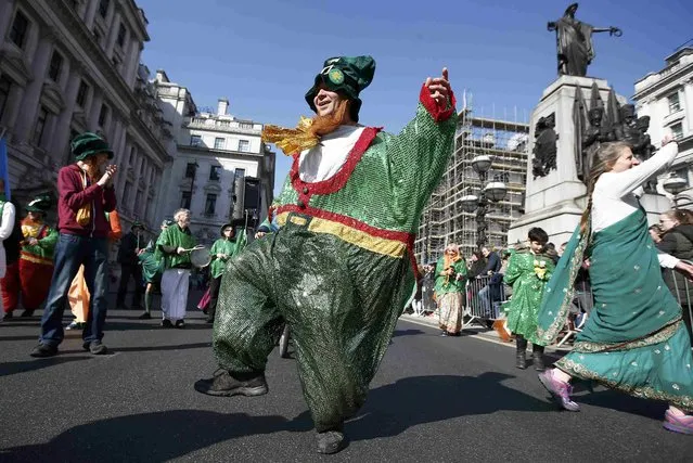 Participants in the St. Patrick's Day Parade perform and process through central London, Britain March 13, 2016. (Photo by Peter Nicholls/Reuters)