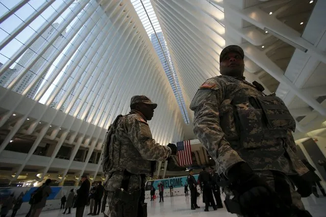 Military personnel walk through the World Trade Center Oculus transportation hub in the Manhattan borough of New York, March 3, 2016. (Photo by Carlo Allegri/Reuters)