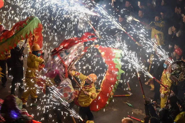 People perform dragon dances with fireworks during a local celebration ahead of China's Lantern Festival in Zunyi, Guizhou province, China February 8, 2017. (Photo by Reuters/Stringer)
