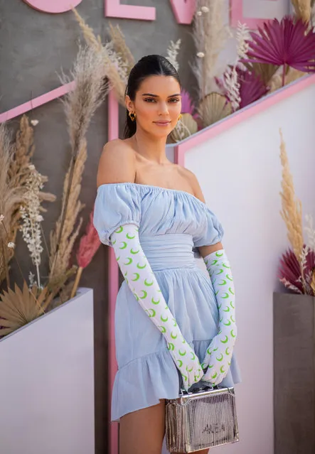 Kendall Jenner is seen wearing blue off shoulder dress, gloves with print at Revolve Festival during Coachella Festival on April 14, 2019 in La Quinta, California. (Photo by Christian Vierig/Getty Images)