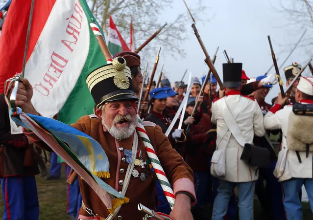 People dressed as Hungarian Hussars and Austrian soldiers of the Habsburg dynasty take part in the re-enactment of the battle of Tapiobicske, Hungary April 4, 2016. (Photo by Laszlo Balogh/Reuters)