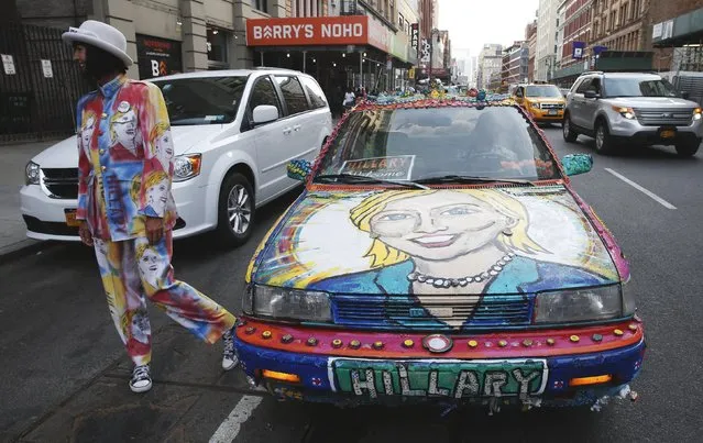Artist Gretchen Baer of BisBee, Arizona, stands next to the “Hillcar”, a car she painted and decorated in support of Democratic U.S. presidential candidate Hillary Clinton, as she stands on a street in the Manhattan borough of New York City, U.S. April 18, 2016. (Photo by Mike Segar/Reuters)