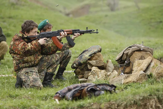 Students from the General Yermolov Cadet School take part in weapons training during a two-day field exercise near the village of Sengileyevskoye, just outside the south Russian city of Stavropol, April 13, 2014. (Photo by Eduard Korniyenko/Reuters)